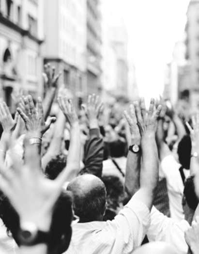 Counter Culture crowd of people with arms raised